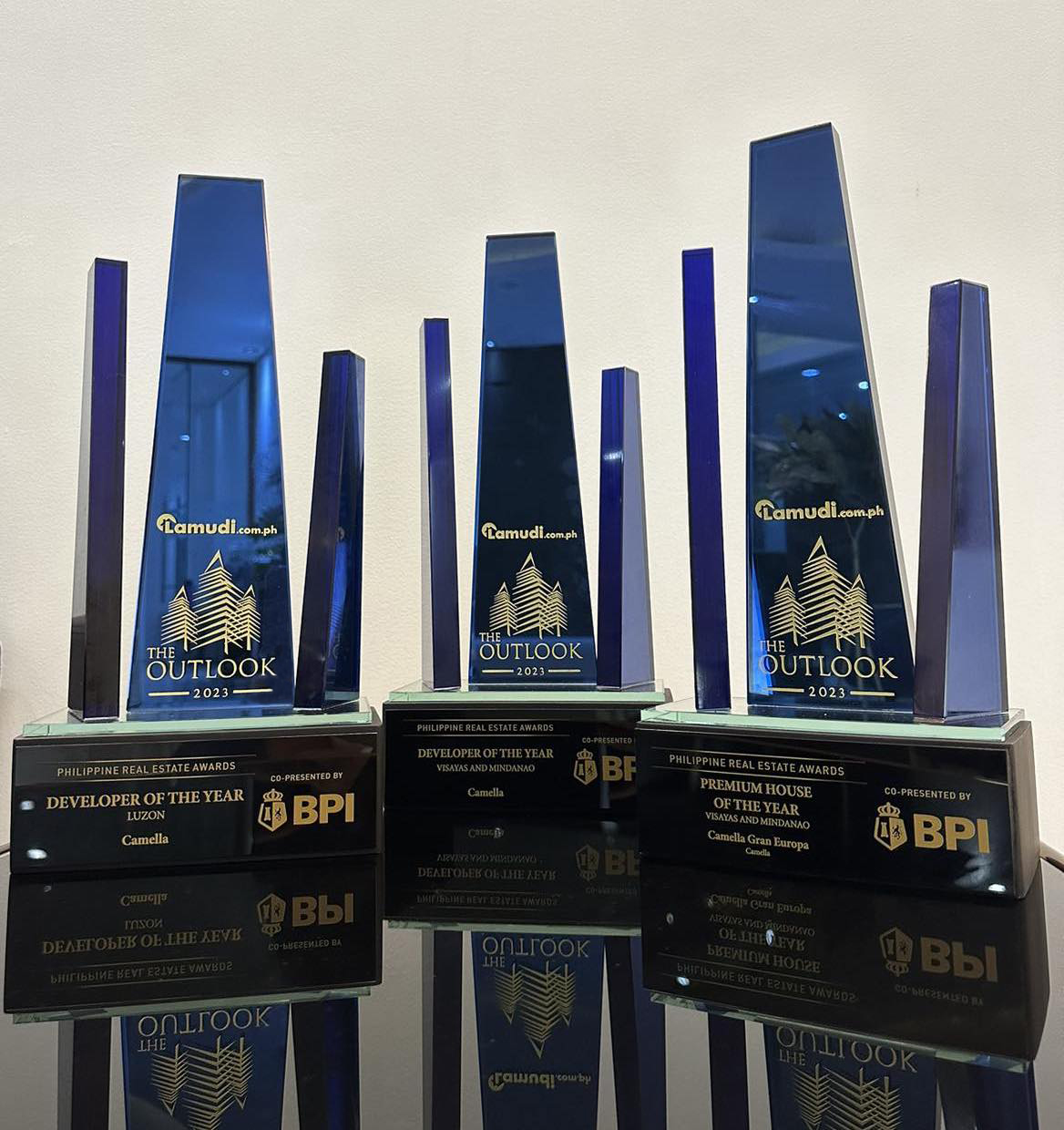Trophies awarded by Lamudi to Camella as Developer of the Year in Luzon, Developer of the Year in Visayas and Mindanao, and Best Premium House in Mindanao.
