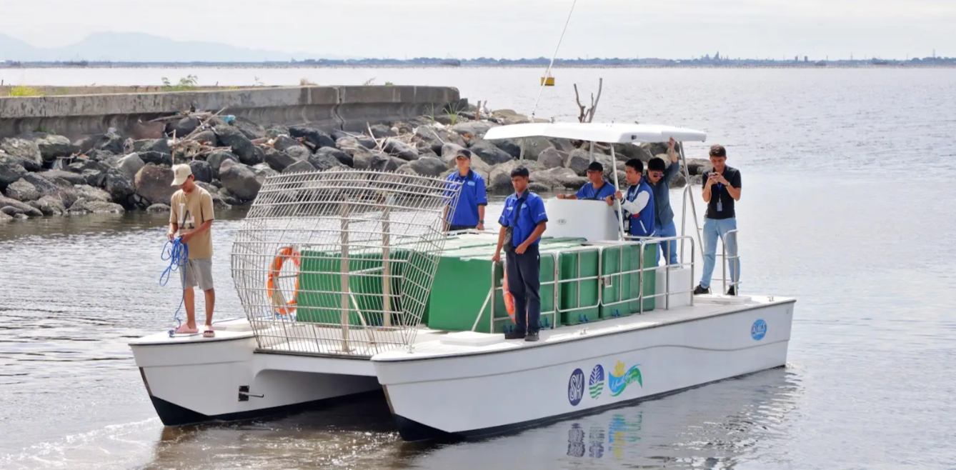 In a joint effort for Manila Bay, SM Prime Holdings (SM Prime), together with the Department of Environment and Natural Resources (DENR), was present for the handover of a state-of-the-art catamaran trash boat to complement the ongoing battle against water pollution. DENR received the boat last January 31, along with essential navigation and safety equipment as well as cleaning tools. The 30-foot catamaran will be operated by the DENR Metropolitan Environmental Office - South Zone and will contribute to the agency's capacity to combat water pollution and preserve the vital marine ecosystem.The 30-foot catamaran is designed to efficiently collect and carry up to 1 ton of waste.

Department of Environment and Natural Resources (DENR) Secretary Maria Antonia Yulo-Loyzaga (middle) receives the symbolic key to a catamaran donated by SM Prime, boosting Manila Bay cleanup efforts.
This donation strengthens the DENR's arsenal in its multifaceted approach to cleaning Manila Bay. The catamaran will enable more efficient removal of floating debris and waste, contributing to the broader effort to improve water quality and restore the bay's ecological health. The partnership with SM Prime exemplifies the power of public-private collaborations in tackling complex environmental challenges.
"This catamaran represents our unwavering commitment to environmental stewardship and our belief in the power of collaboration to create a sustainable future for our communities," said SM Supermalls Vice President Engr. Liza Silerio, emphasizing the shared vision of both organizations. SM Prime's contribution complements the DENR's ongoing initiatives, including the Paranaque Adopt-a-River project, and underscores the importance of collaborative efforts in achieving lasting environmental improvements.

From left: Department of Environment and Natural Resources (DENR) Undersecretary Jonas Leones, DENR National Capital Region (NCR) Regional Executive Director Michael Drake Matias, DENR Assistant Secretary and Environmental Management Bureau Director Jacqueline Caancan, SM Supermalls Vice President Engr. Liza Silerio, DENR Secretary Maria Antonia Yulo-Loyzaga, and SM Prime Estate Management and Development Senior Assistant Vice President Orliber Paule at the catamaran handover ceremony. 
The presence of DENR Secretary Maria Antonia Yulo-Loyzaga and other DENR officials emphasized the agency's commitment to leveraging partnerships to achieve its environmental goals. The catamaran will play a crucial role in the DENR's continued efforts to protect Manila Bay from pollution and preserve its valuable resources for future generations. This collaboration serves as a model for how public and private sectors can work together to address pressing environmental concerns and create a healthier environment.
